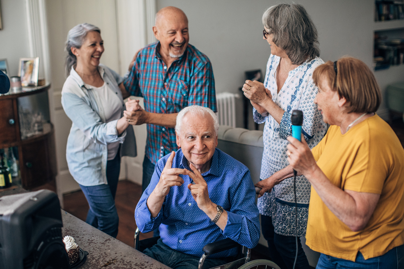 Old people having a karaoke party in nursing home
